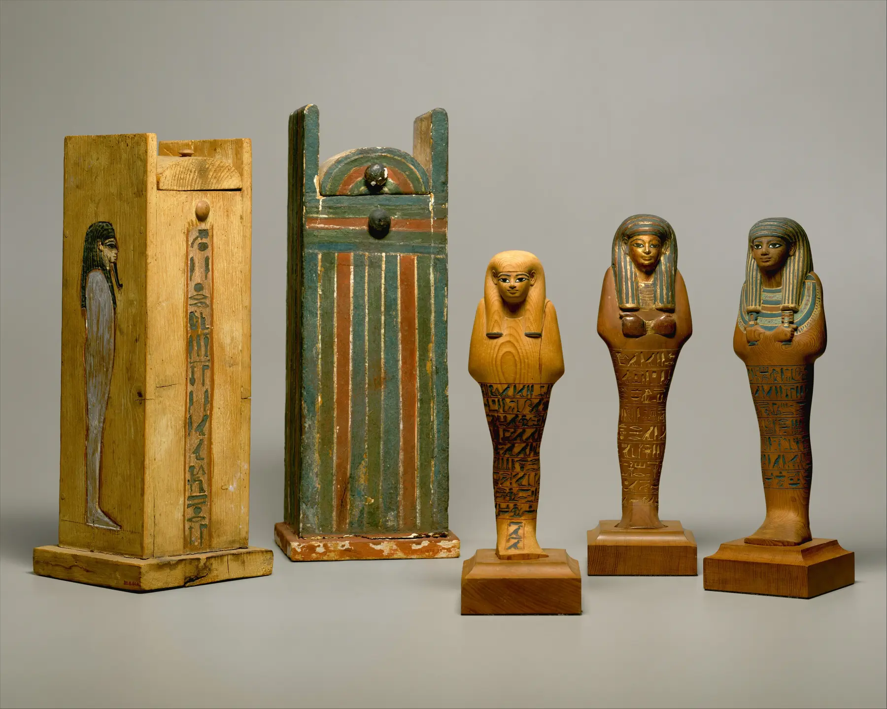 Two painted wooden boxes and three standing shabti figures made for Yuya, Dynasty 18, in the Metropolitan Museum of Art