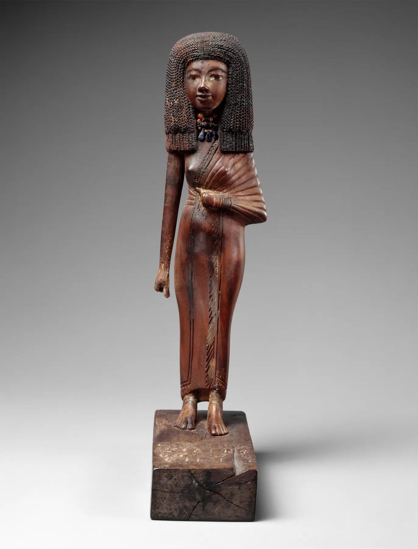 Statuette of the lady Tiye, 24 cm; materials listed include wood, gold, glass and Egyptian blue; Met 41.2.10